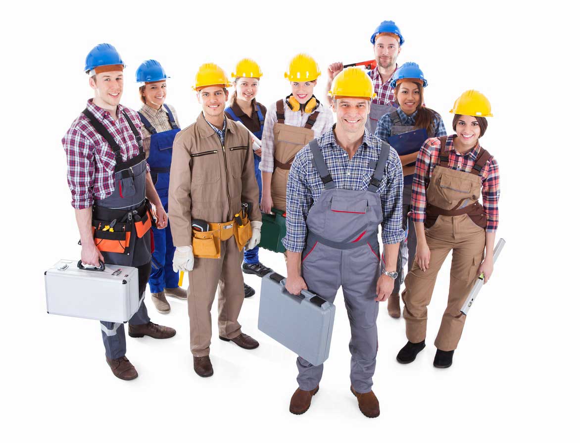A group of people in construction hats and overalls.